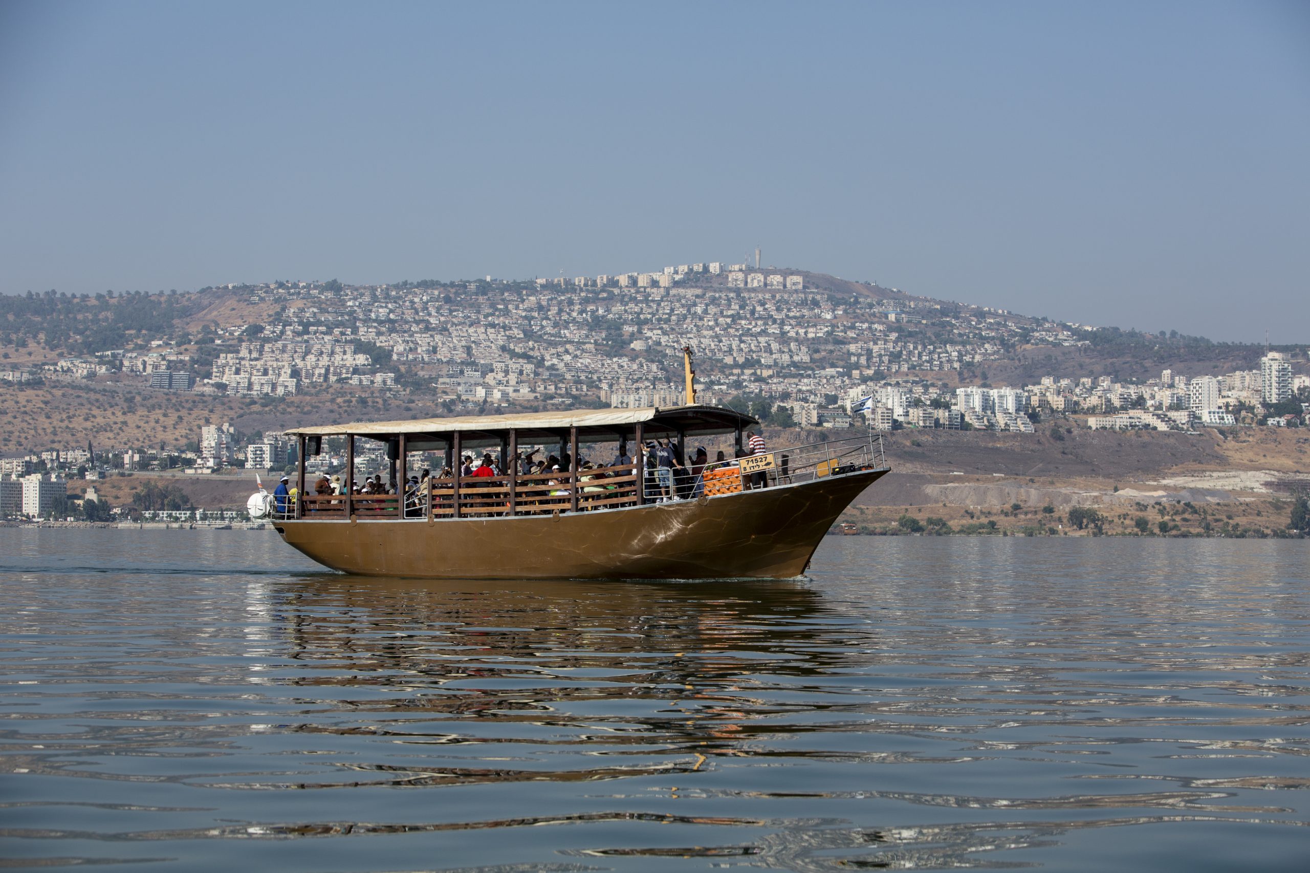 Tiberias  is a city on the western shore of the Sea of Galilee in the Lower Galilee. Established in 20 CE, it was named in honour of the emperor Tiberius.Tiberias has been venerated in Judaism since the middle of the 2nd century CE and since the 16th century has been considered one of Judaism's Four Holy Cities, along with Jerusalem, Hebron and Safed.In the 2nd-10th centuries, Tiberias was the largest Jewish city in the Galilee and the political and religious hub of the Jews of Palestine. According to Christian tradition, Jesus performed several miracles in the Tiberias district, making it an important pilgrimage site for Christians. Tiberias has historically been known for its hot springs, believed to cure skin and other ailments, for thousands of years.The picture shows a Pilgrim' s boat on the lake. Photo by Itamar Grinberg.